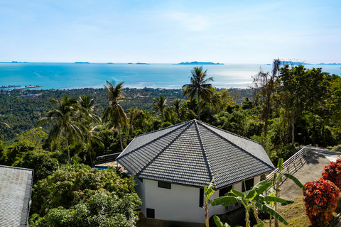 Peaceful hillside view over Paradise Village with tropical greenery in Nathon.