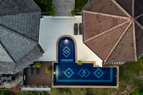 Bird’s-eye view of Villa sunrise shared infinity pool and terrace in the hillside