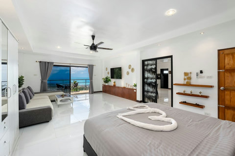 Traditional Thai-style villa entrance with covered walkway at Moonview Paradise Village Koh Samui