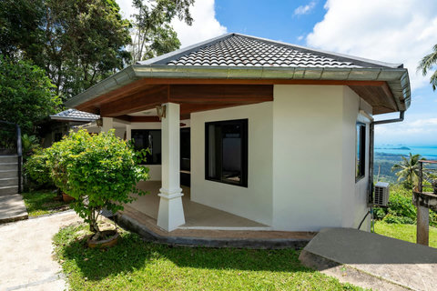 Covered outdoor terrace with breathtaking ocean views at Moonview Paradise Village Koh Samui