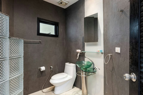 Clean modern bathroom with rainfall shower at Sunview Paradise Village Koh Samui