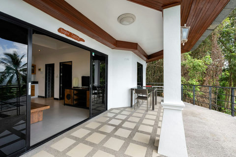 Spacious open-plan living area with traditional Thai wooden beams at Sunview Paradise Village Koh Samui