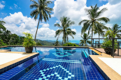Sparkling blue tile pool overlooking the Gulf of Thailand at Koh Samui vacation rental resort
