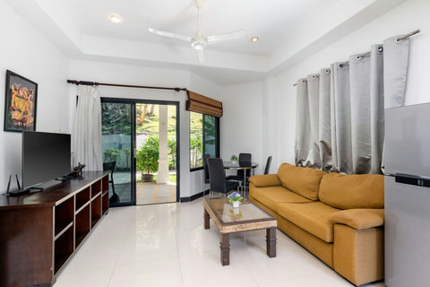 Cozy living room with sofa bed as additional sleeping space, ideal for families visiting Koh Samui