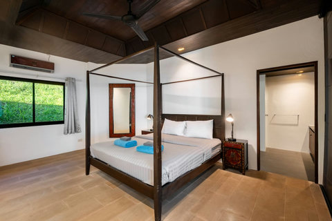 Spacious bedroom with elegant canopy bed at Sunhouse - Koh Samui hillside villa at Paradise Village