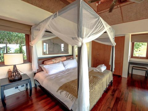 Elegant bedroom with canopy bed, vaulted ceiling and garden views - Villa Soluna 5-bedroom luxury hillside retreat southern Koh Samui