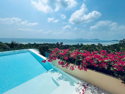 Infinity pool with vibrant bougainvillea flowers and spectacular ocean views - Villa Soluna 5-bedroom luxury hillside retreat southern Koh Samui