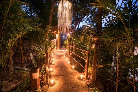 Tropical jungle pathway illuminated by candlelight at night - Villa Soluna natural surroundings 5-bedroom luxury hillside retreat southern Koh Samui