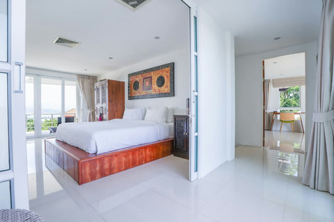 Vibrant bedroom with colorful headboard and accent pillows