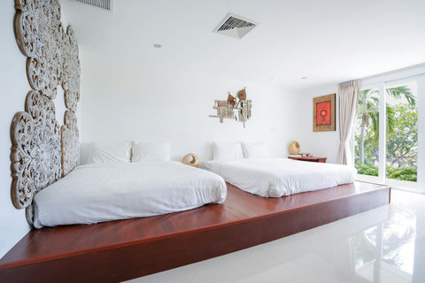 Cozy bedroom with neutral tones and decorative artwork