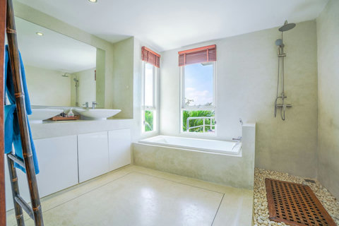 Luxurious white bathroom with deep soaking tub and modern finishes