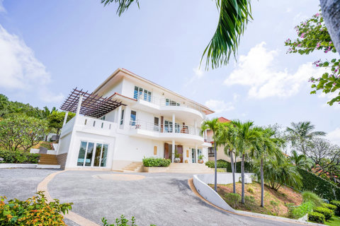 Villa complex with landscaped gardens and terraced buildings