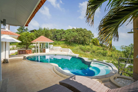 Private pool with turquoise water and tropical garden setting