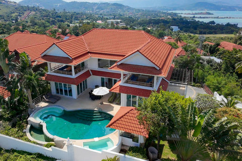Aerial view of the villa complex with red tile roofs and private pool