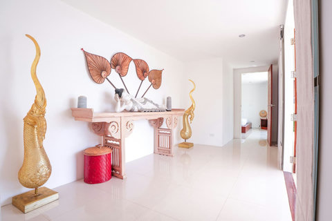 Open-plan living area with colorful accents and staircase
