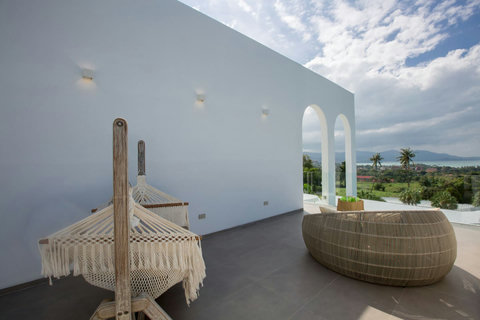 Hanging swing chair in the tropical garden for relaxation at C Villa, luxury Koh Samui vacation rental
