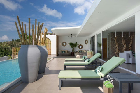 Poolside loungers under covered terrace for sun and shade at C Villa, Koh Samui holiday villa