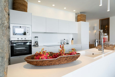 Fresh tropical fruit welcome display in the bright modern kitchen at C Villa, Koh Samui holiday home