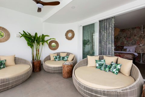 Luxurious circular daybed lounge with tropical palm accents at C Villa, Koh Samui private villa