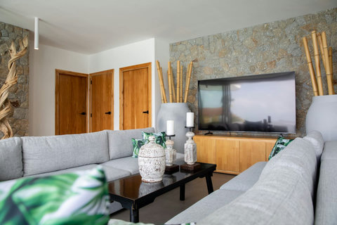 Climate-controlled living room with tasteful decor and comfortable sofas at C Villa, Koh Samui rental