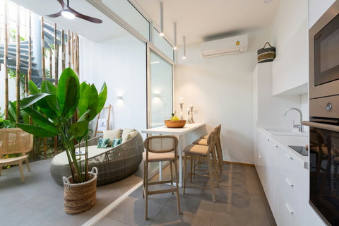 Compact kitchenette with breakfast bar and tropical greenery at C Villa, Koh Samui Thailand vacation home