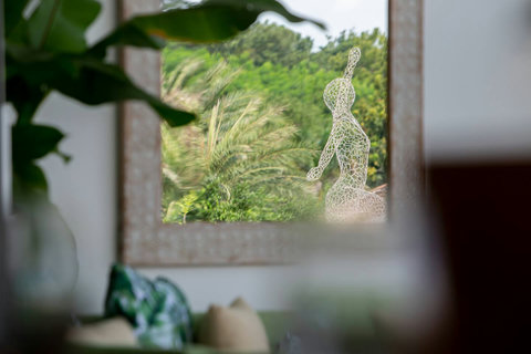Decorative garden sculpture amid lush tropical landscaping at C Villa, Koh Samui private estate