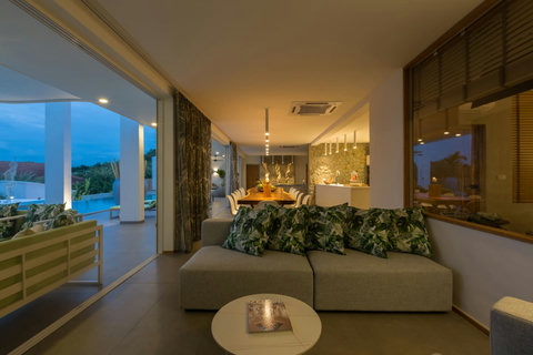 Romantic candlelit dinner setting in the open-air dining pavilion at C Villa, Koh Samui luxury rental