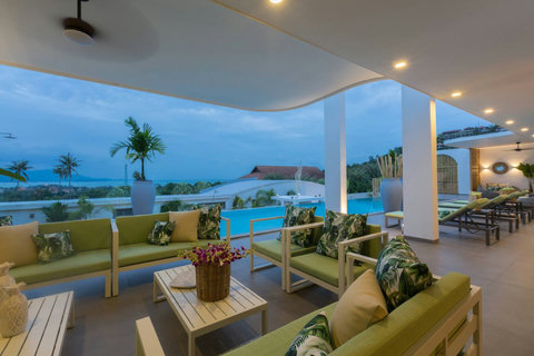 Covered terrace with breathtaking ocean panorama and outdoor seating at C Villa, Koh Samui Thailand