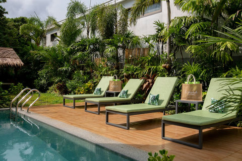 Sun loungers lined up beside the sparkling private pool at C Villa, luxury Koh Samui vacation rental