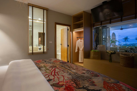 Charming bedroom with bamboo-inspired curtains and warm tropical ambiance at C Villa, Koh Samui