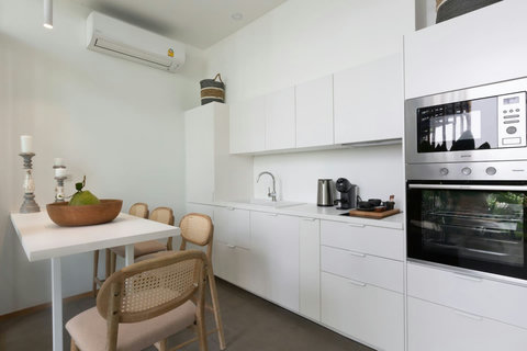 Spacious modern white kitchen with full-size oven and ample counter space at C Villa, Koh Samui