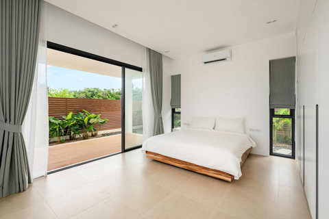 Spacious master bedroom with pool and garden views Mark Marlow Samui