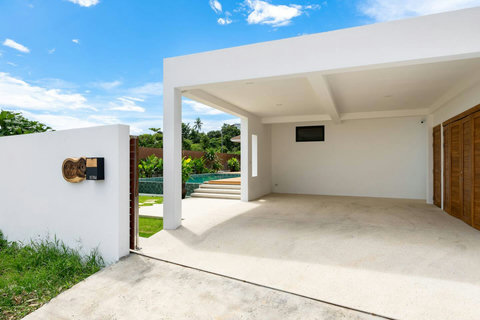 Covered carport entrance to villa Mark Marlow Koh Samui Thailand