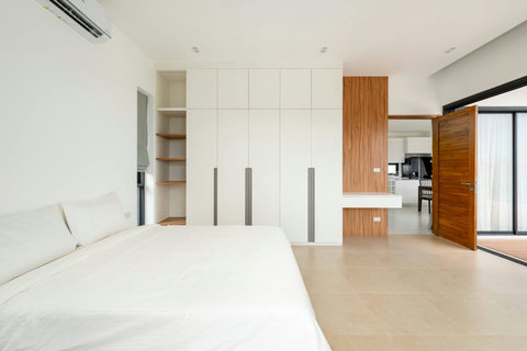 Minimalist white kitchen with wooden accents Mark villa Marlow Koh Samui