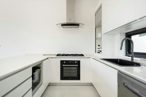 Modern white kitchen with sleek appliances Mark villa Marlow Samui