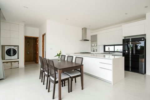 Open-plan kitchen and dining area with modern appliances Mark Marlow Samui