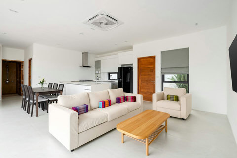 Spacious open-plan living area with modern kitchen Mark villa Marlow Samui