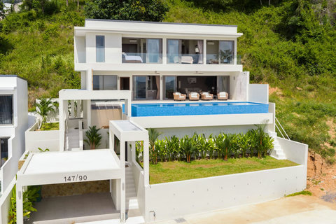 Three-level contemporary villa with ocean-facing bedrooms and a private infinity pool