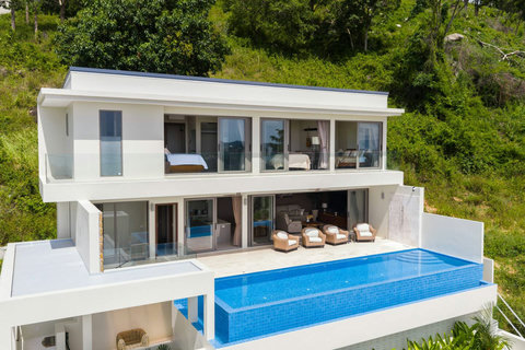 Relax by the infinity pool with panoramic ocean and jungle views. Perfect for morning swims or sunset cocktails