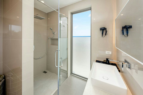 leek guest bathroom with warm lighting and contemporary design