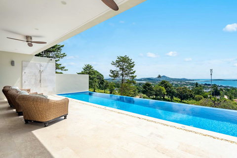 Relax by the infinity pool with panoramic ocean and jungle views. Perfect for morning swims or sunset cocktails