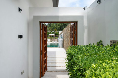 Elegant entrance hallway with pool views Villa Jasmine Koh Samui luxury private pool villa Thailand