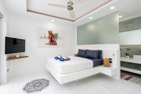 Bright white bedroom with modern amenities Villa Jasmine Koh Samui