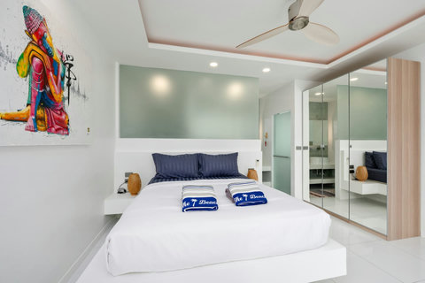 Stylish master bedroom with vibrant artwork Villa Jasmine Koh Samui luxury private pool villa Thailand