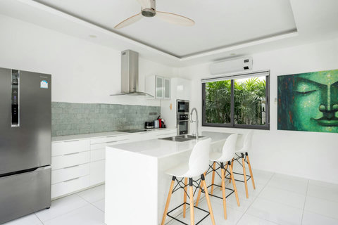 Gourmet kitchen with breakfast bar and garden views Villa Jasmine Koh Samui luxury villa rental Thailand
