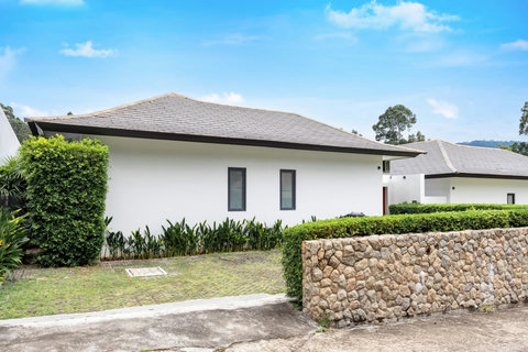 Modern villa exterior with private driveway Villa Jasmine Koh Samui luxury villa rental Thailand secure property