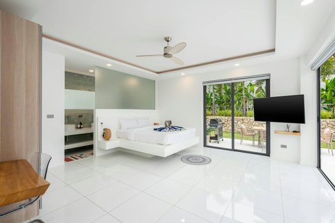 Master suite with tropical garden courtyard Villa Jasmine Koh Samui luxury villa rental Thailand flat screen TV