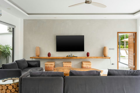 Open-plan living area with pool access Villa Jasmine Koh Samui luxury private pool villa Thailand entertainment