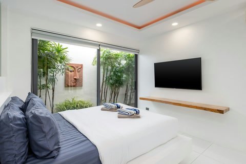 Serene bedroom with garden courtyard views Villa Jasmine Koh Samui luxury villa rental Thailand tropical