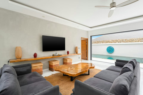 Contemporary lounge with pool views and natural textures Koh Samui